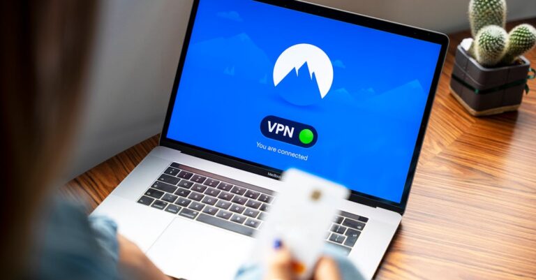 A person using a VPN on a laptop, symbolizing secure internet browsing in a modern indoor setting.
